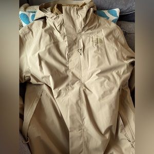 Northface tan winter coat XL with zip out puffer type liner water resistant